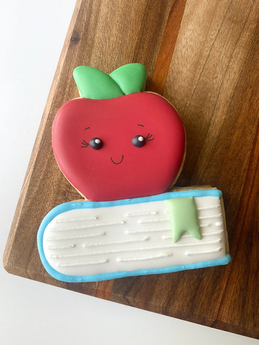 Apple on Top of Book